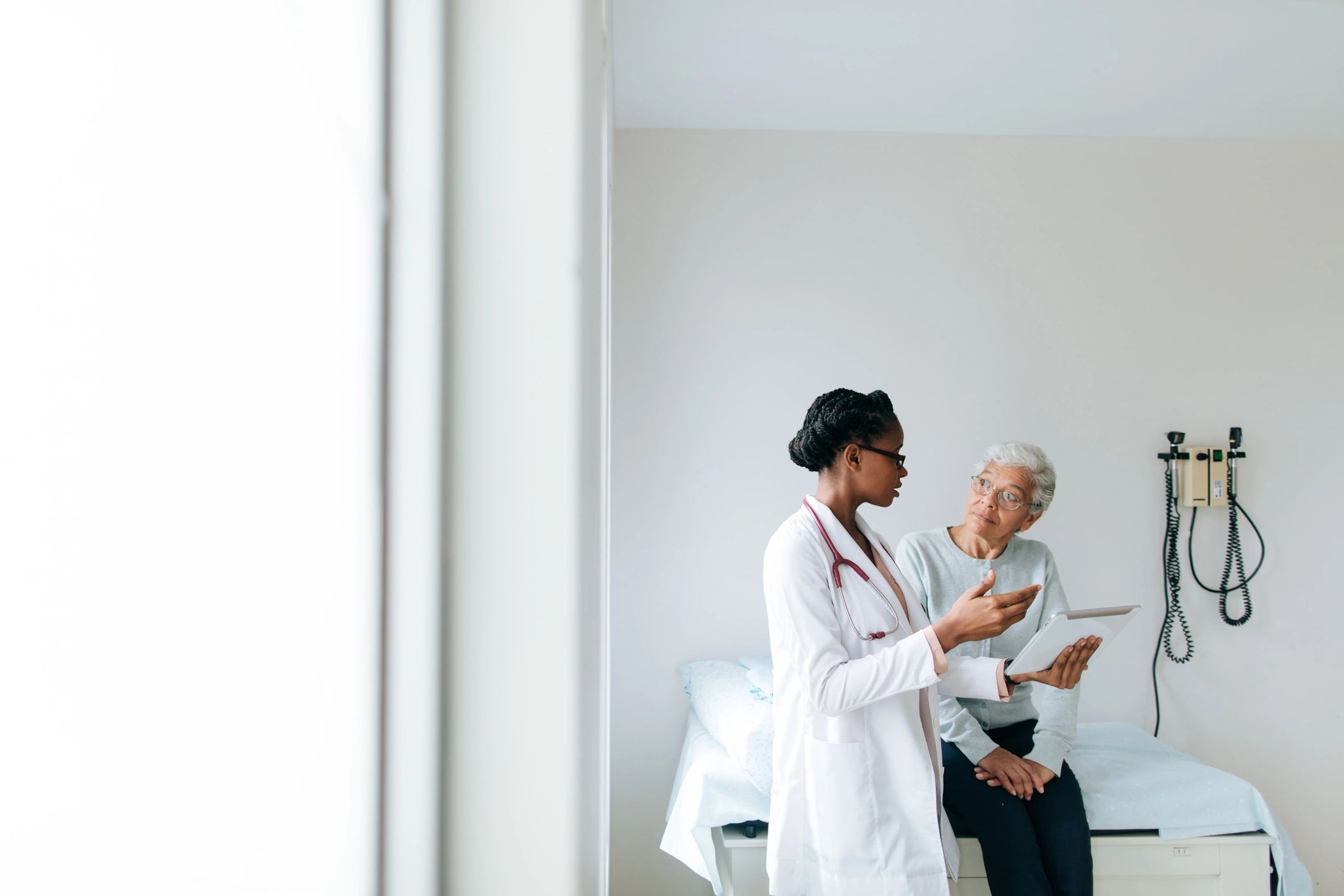 Doctor reviewing care information with patient