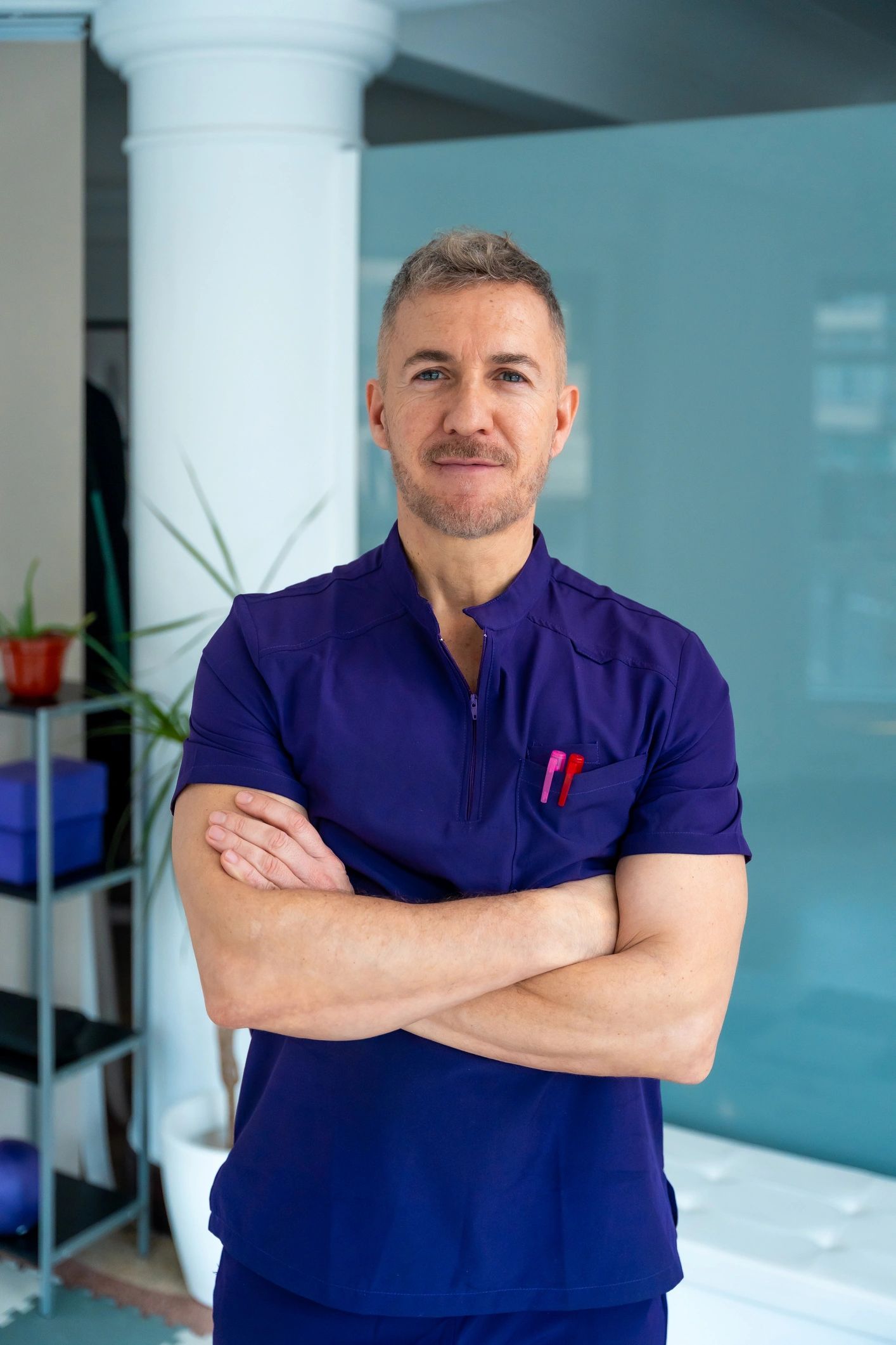 Confident male healthcare professional in clinic